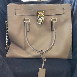 Michael Kors all leather beautifullymade tan tote with great gold chain accents